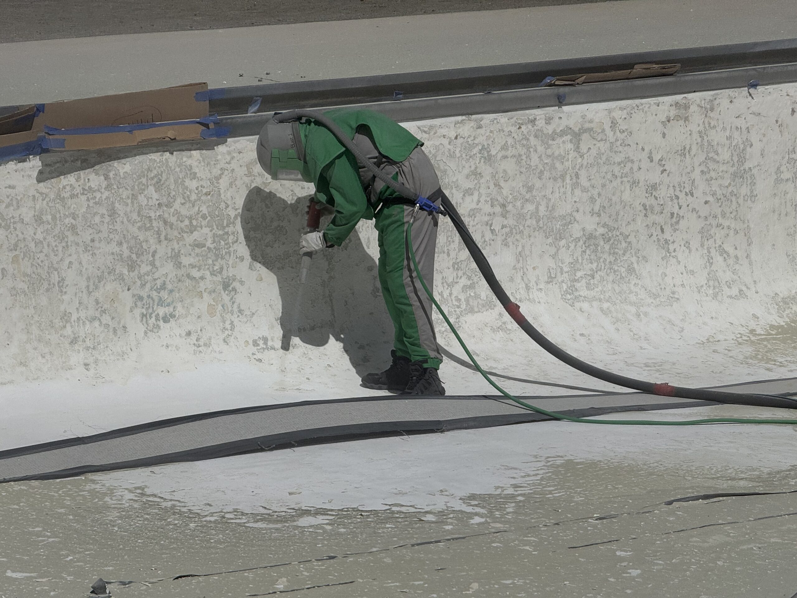 Swimming Pool Paint Etching – Smugglers’ Notch Resort, Jeffersonville, Vermont Swimming pool at Smugglers’ Notch Resort in Jeffersonville Vermont professionally sandblasted to etch the existing painted surface for a new coating