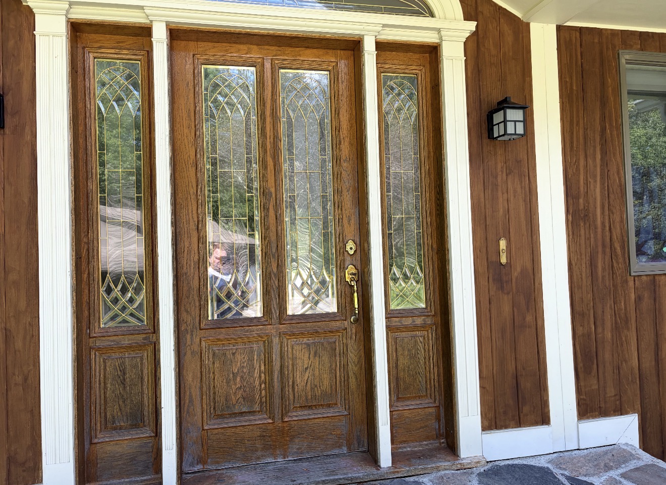 Front Door & Entryway Wood Restoration – Rutland, Vermont Before and after restoration of a weathered wood front door entryway in Rutland Vermont, sandblasted back to fresh wood and finished with a light golden sealer
