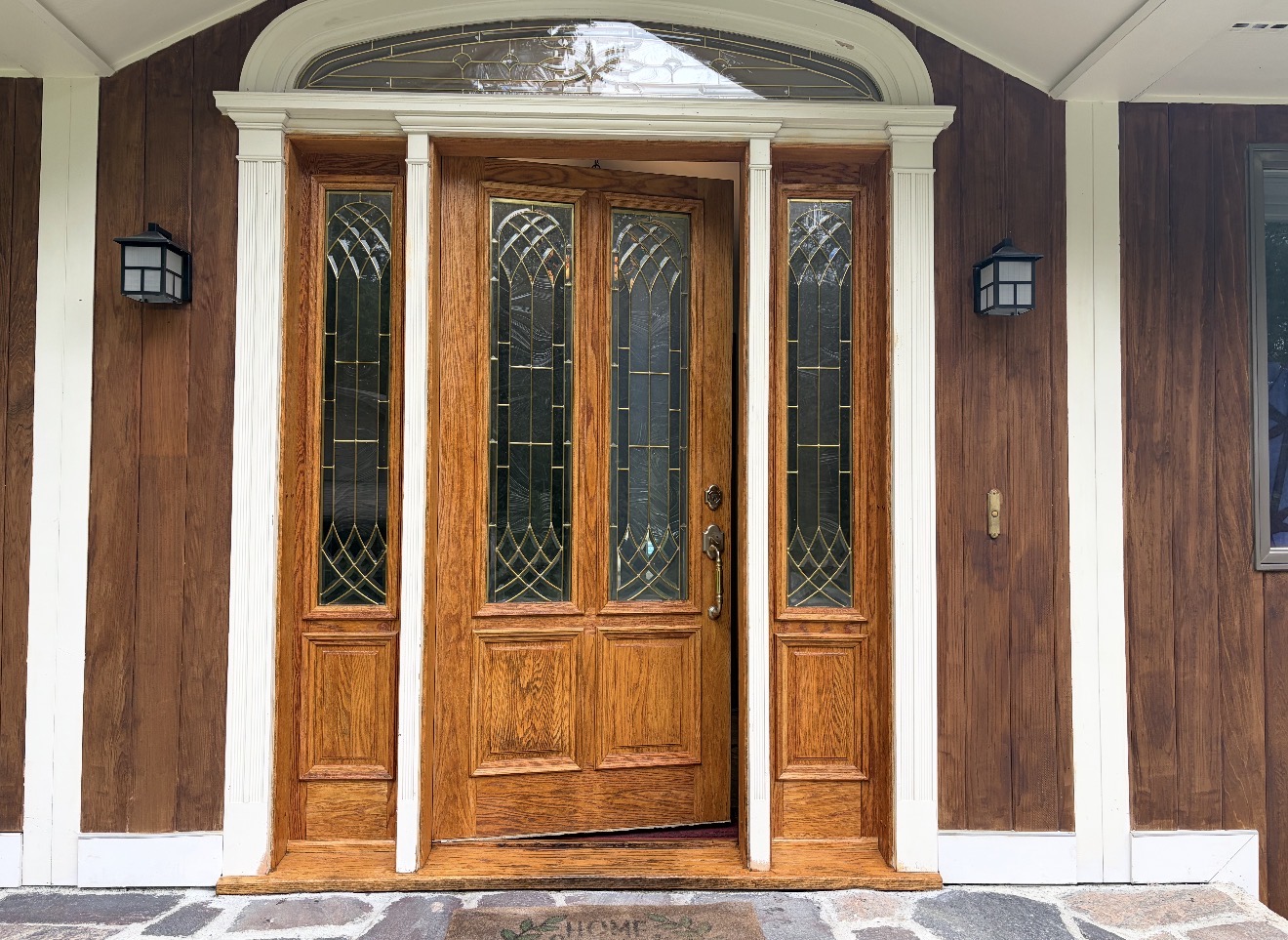Front Door & Entryway Wood Restoration – Rutland, Vermont Before and after restoration of a weathered wood front door entryway in Rutland Vermont, sandblasted back to fresh wood and finished with a light golden sealer