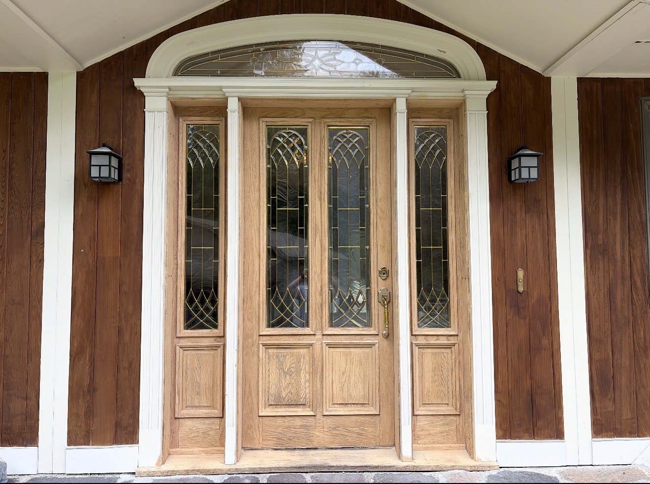 Front Door & Entryway Wood Restoration – Rutland, Vermont Before and after restoration of a weathered wood front door entryway in Rutland Vermont, sandblasted back to fresh wood and finished with a light golden sealer