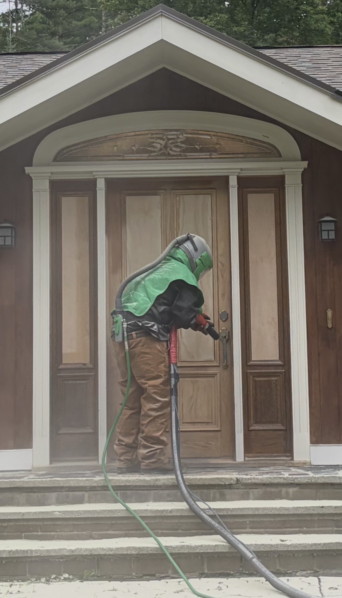 Front Door & Entryway Wood Restoration – Rutland, Vermont Before and after restoration of a weathered wood front door entryway in Rutland Vermont, sandblasted back to fresh wood and finished with a light golden sealer