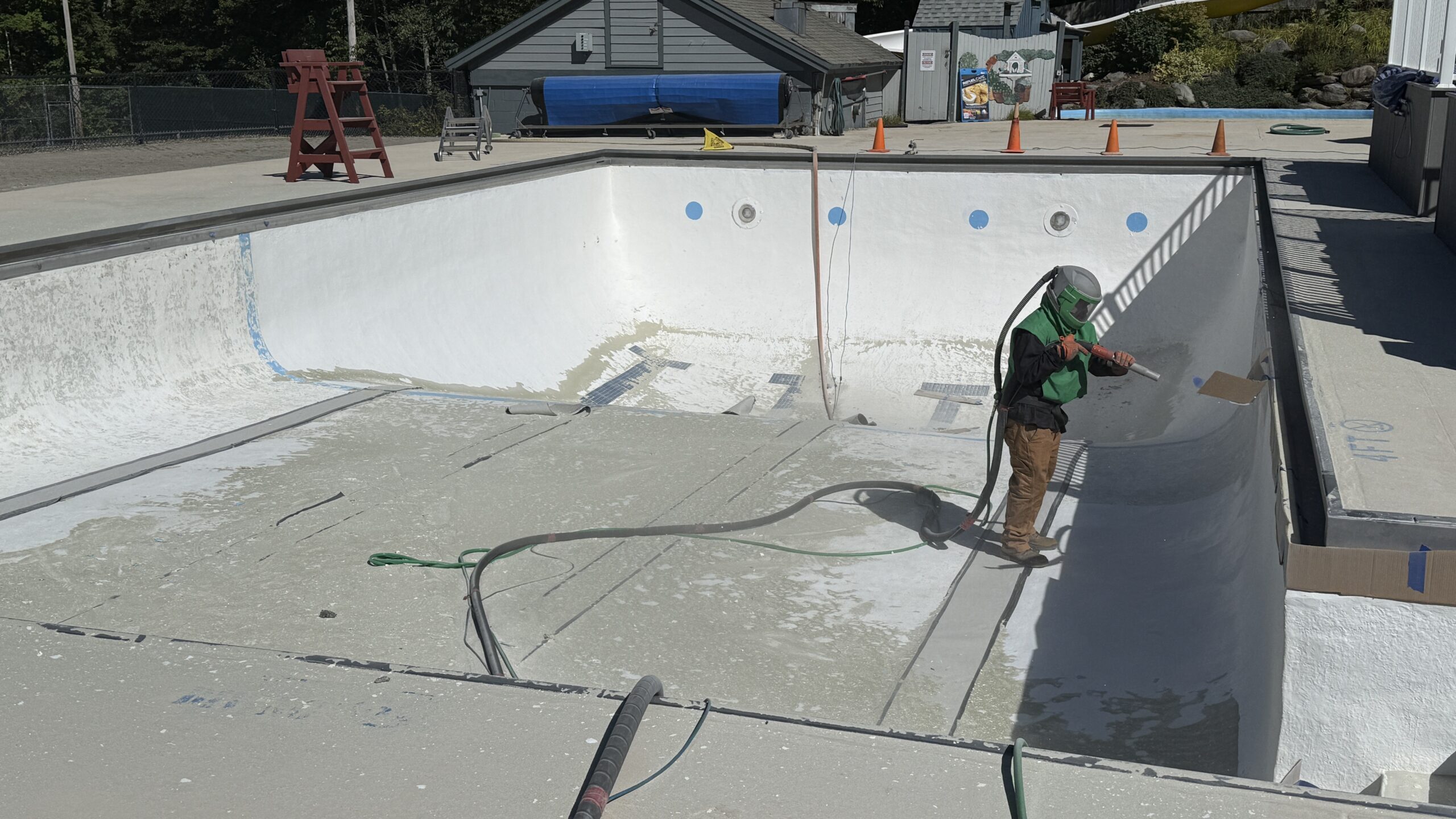Swimming Pool Paint Etching – Smugglers’ Notch Resort, Jeffersonville, Vermont Swimming pool at Smugglers’ Notch Resort in Jeffersonville Vermont professionally sandblasted to etch the existing painted surface for a new coating
